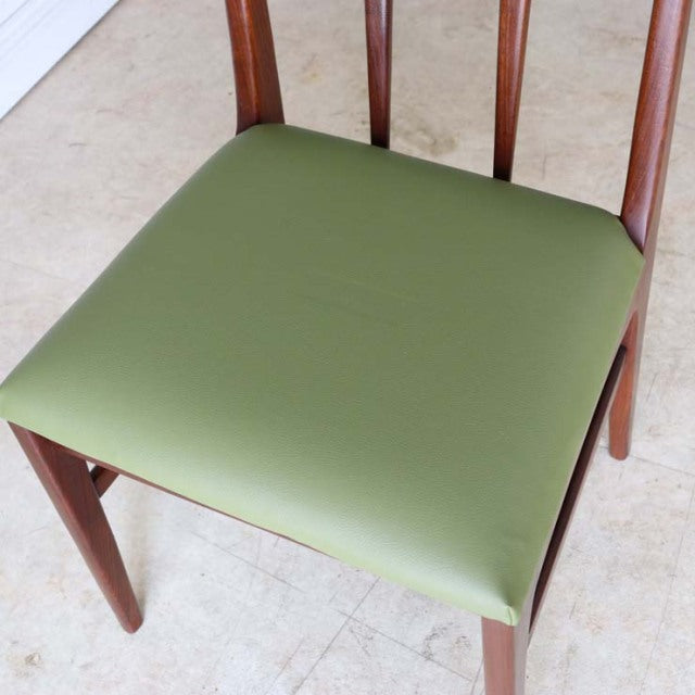 Mid-century British vintage teak dining chair by A.Younger Ltd. with green vinyl seat and tapered legs.