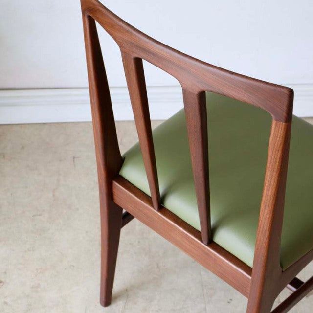 Vintage teak dining chair by A.Younger Ltd., British mid-century design with green leather seat and elegant tapered legs.