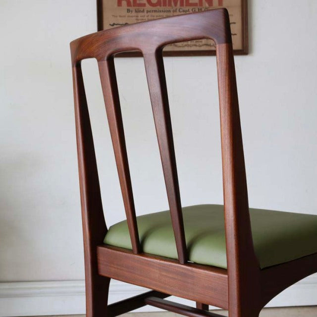 Vintage British mid-century teak dining chair by John Herbert Fonseca with olive green seat and slender vertical back slats.