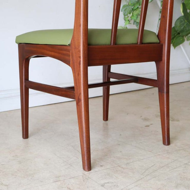 Mid-century British vintage teak dining chair by A.Younger Ltd. with sleek tapered legs and olive green upholstered seat.