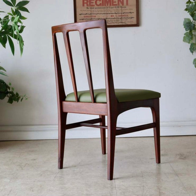 Mid-century British vintage teak dining chair by A.Younger Ltd., slender legs, vertical slat back, olive green seat cushion.