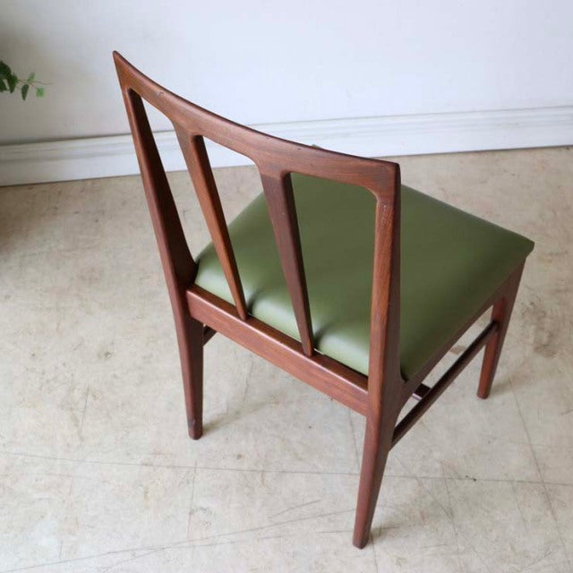 Vintage mid-century teak dining chair by A.Younger Ltd. with British-Danish design, olive green seat, angular backrest, and.