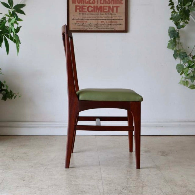 Mid-century British vintage teak dining chair by A.Younger Ltd with sleek tapered legs and olive green cushioned seat.