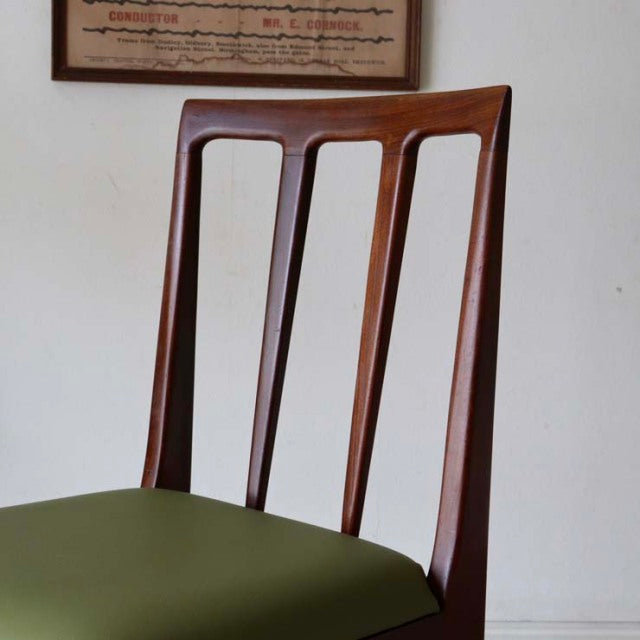 Mid-century British vintage teak dining chair by A.Younger Ltd, sleek vertical slats and green upholstered seat.