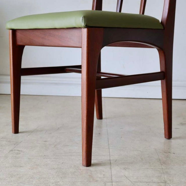 Mid-century British teak dining chair by A.Younger Ltd., smooth wood grain, tapered legs, green upholstered seat, Denmark.