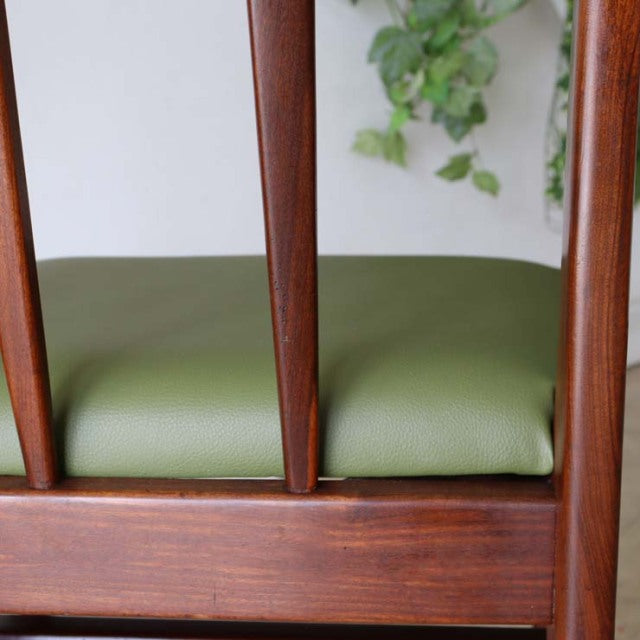 Mid-century British vintage teak dining chair by A.Younger Ltd. with olive green upholstered seat and slender vertical back.