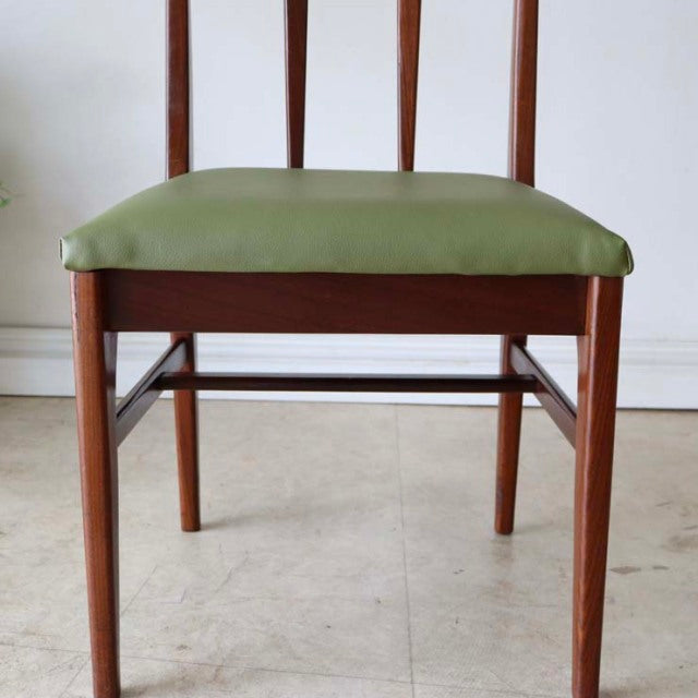 Set of four vintage British mid-century dining chairs by A.Younger Ltd., teak frames with rich wood grain and green.