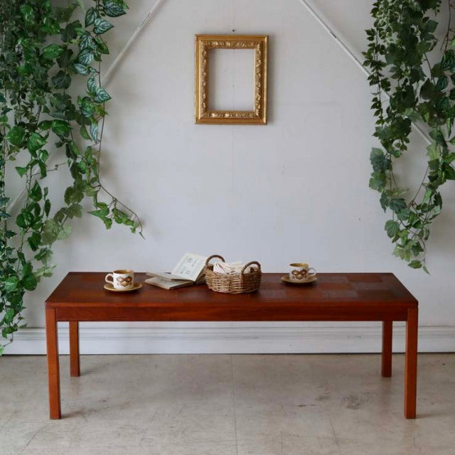 Mid-century vintage teak coffee table by Heggen Nordfjordeid, sleek rectangular top with visible wood grain and straight.