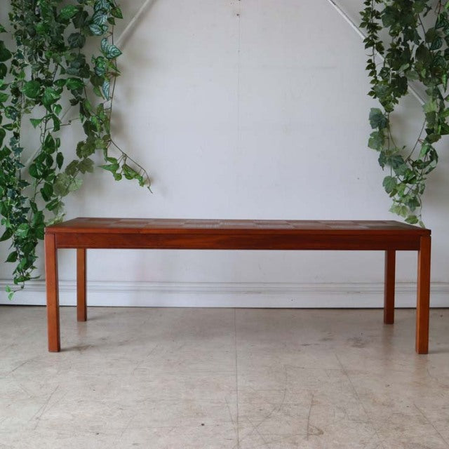 Mid-century vintage teak coffee table with clean lines, rectangular top, and slender straight legs, Danish-British style.