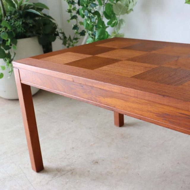 Mid-century teak coffee table with checkerboard rosewood top, slender square legs, vintage British-Denmark design, smooth.
