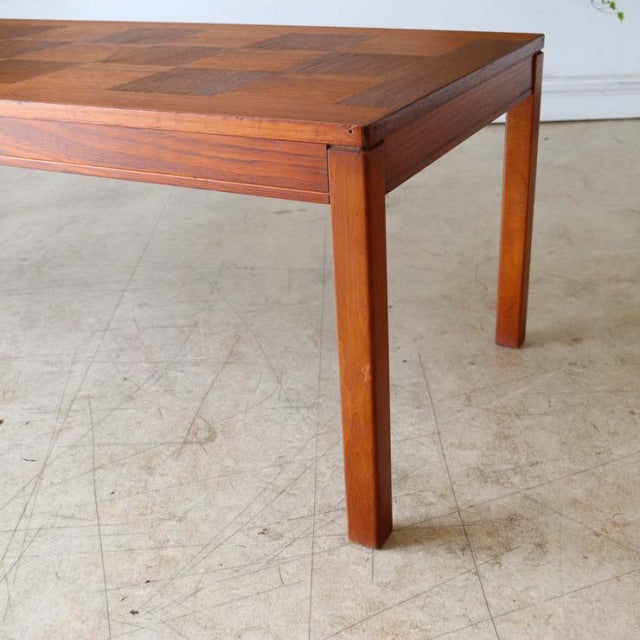 Vintage mid-century teak coffee table with rosewood grain top and straight square legs, Danish-British design.