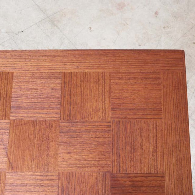Mid-century teak coffee table top with square wood grain pattern and smooth polished finish.