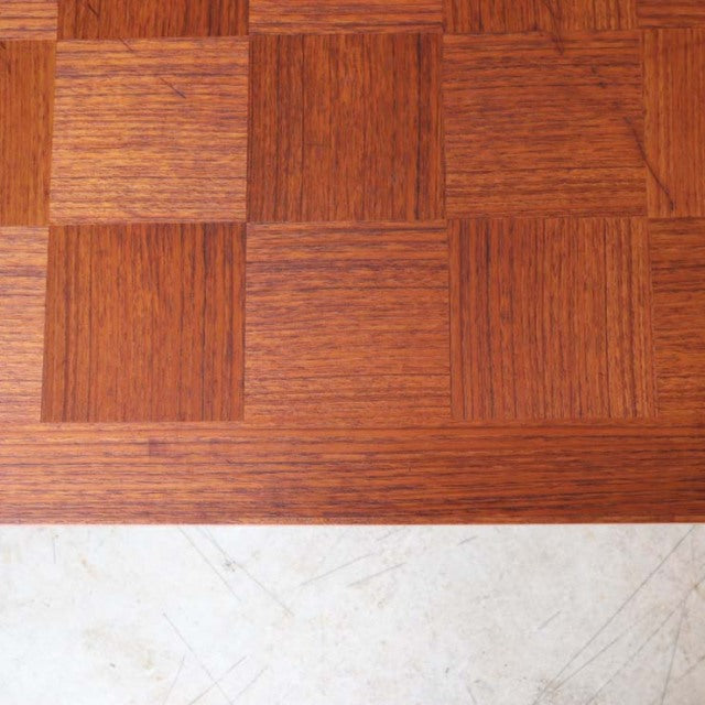 Mid-century teak wood coffee table top with checkerboard grain pattern from vintage British-Denmark design.