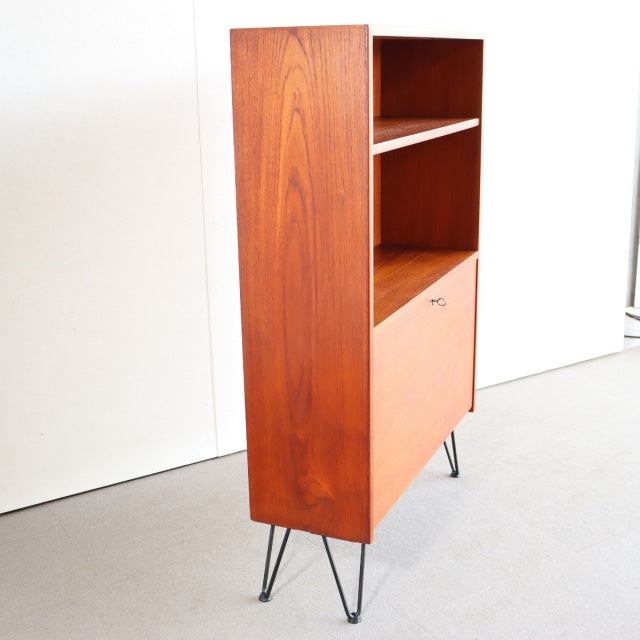 Vintage mid-century Danish teak shelving unit with clean grain, iron hairpin legs, and minimalist British design accents.