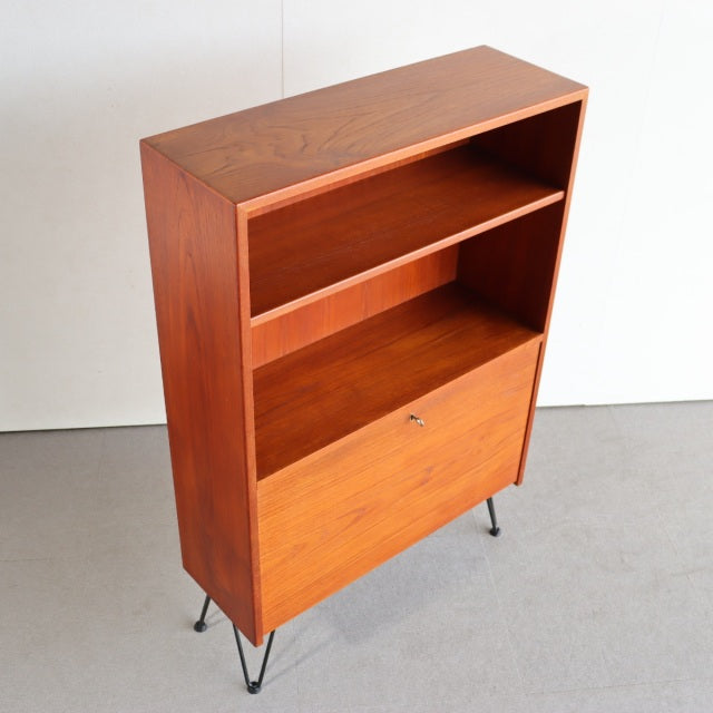 Vintage mid-century teak cabinet from Denmark with iron hairpin legs, showcasing rich wood grain and clean lines.