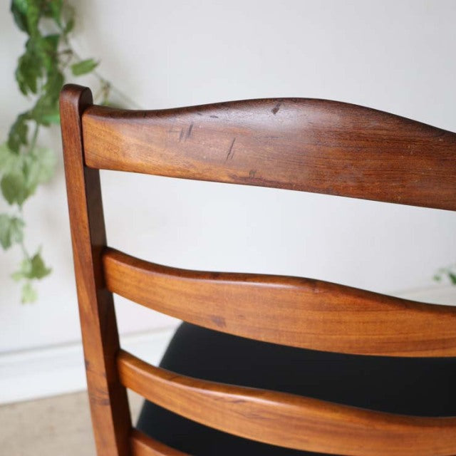 Vintage teak G-Plan ladder back dining chair showcasing rich wood grain, smooth curved slats, and mid-century British design.