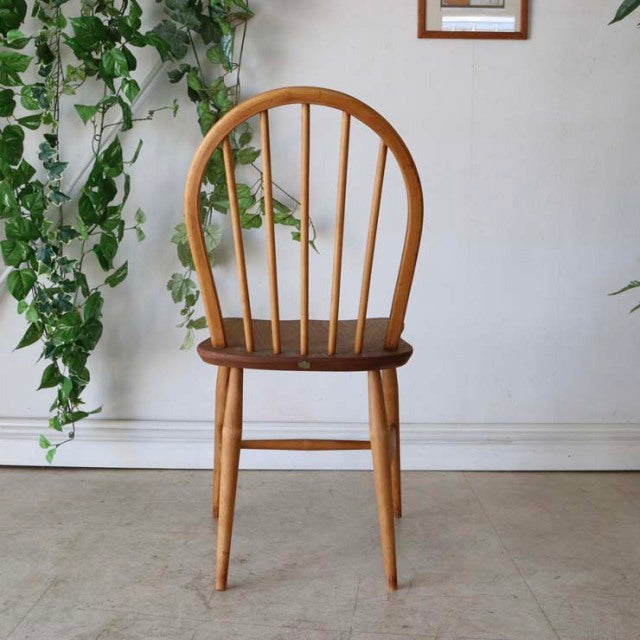 Vintage teak ERCOL mid-century hoop back dining chair with curved spindle back and tapered legs, British design.