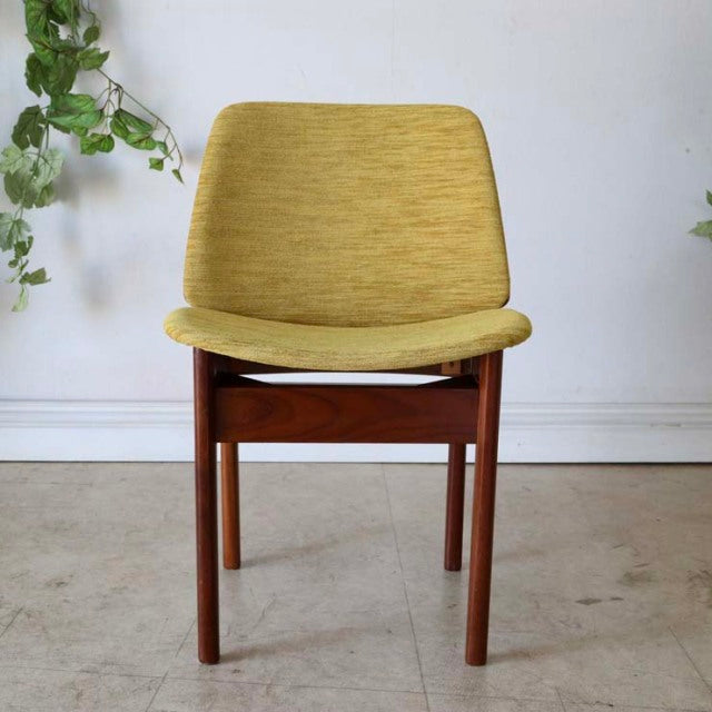 Vintage mid-century British teak dining chair by Elliotts of Newbury with mustard yellow fabric seat and curved backrest.
