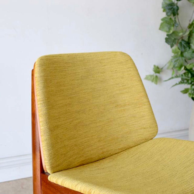 Vintage mid-century teak dining chair by Elliotts of Newbury with mustard yellow fabric upholstery and clean wooden frame.