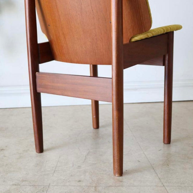 Vintage mid-century teak dining chair by Elliotts of Newbury, British design with clean lines and visible wood grain on.