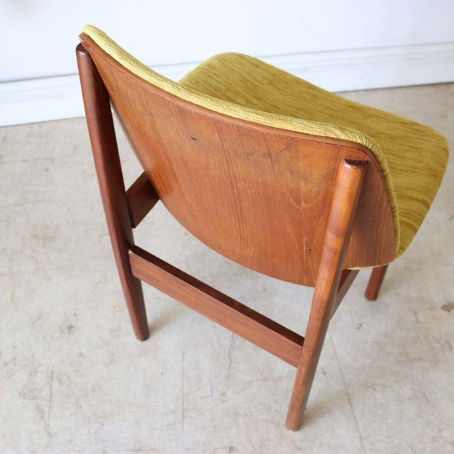 Vintage mid-century British dining chair by Elliotts of Newbury with rich teak wood frame and yellow-green upholstered seat, .