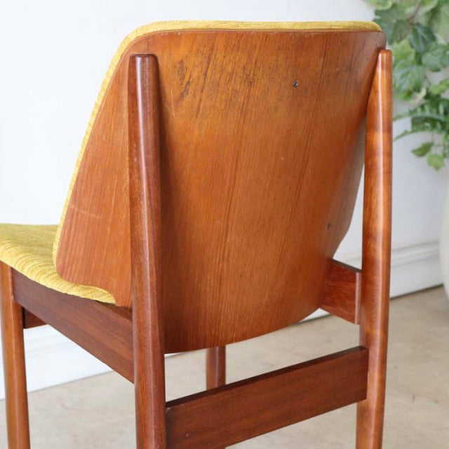 Vintage mid-century British teak dining chair by Elliotts of Newbury, solid wood grain, tapered legs, gently curved.