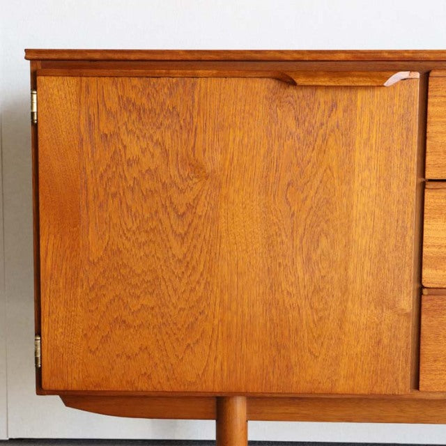 Vintage teak mid-century sideboard door panel with rich wood grain and rounded corner, British Denmark design by Austinsuite.