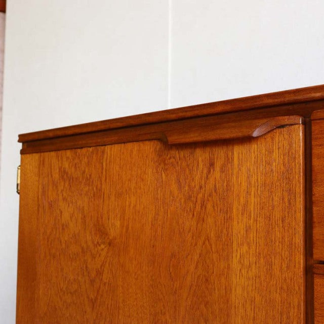 Vintage teak sideboard by Austinsuite featuring smooth wood grain, clean mid-century lines, and minimalist recessed handles.