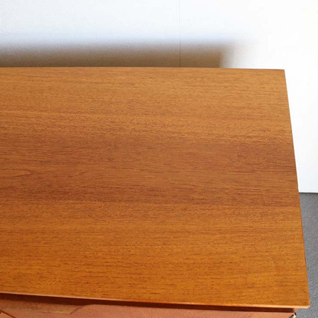 Vintage teak Austinsuite sideboard top surface showing smooth wood grain with warm mid-century British design.