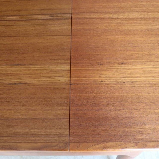 Mid-century vintage teak dining table top with rich wood grain and smooth finish, Danish design.