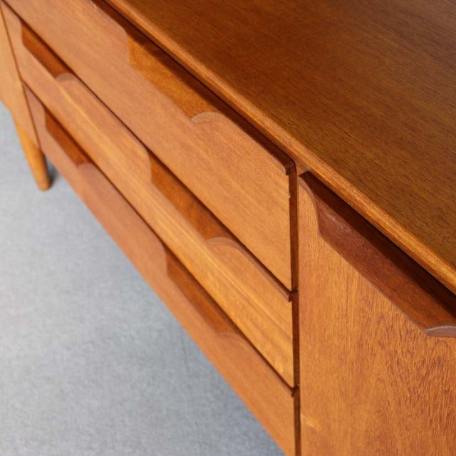 Vintage teak mid-century sideboard by Austinsuite, British-Denmark design, smooth wood grain, tapered legs, minimalist.