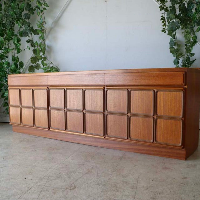 Vintage McIntosh mid-century teak sideboard with British-Denmark design, square panel doors, and tapered legs.