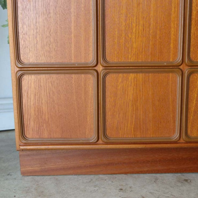 Vintage mid-century teak sideboard by McIntosh, British design with smooth wood grain and rounded square panel details on.