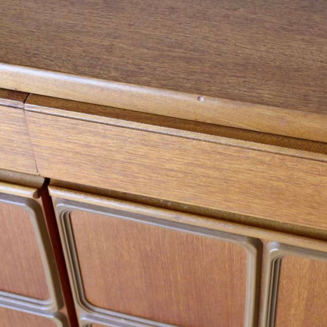 Vintage teak sideboard by McIntosh featuring British mid-century design with smooth wood grain and sculpted panel legs.