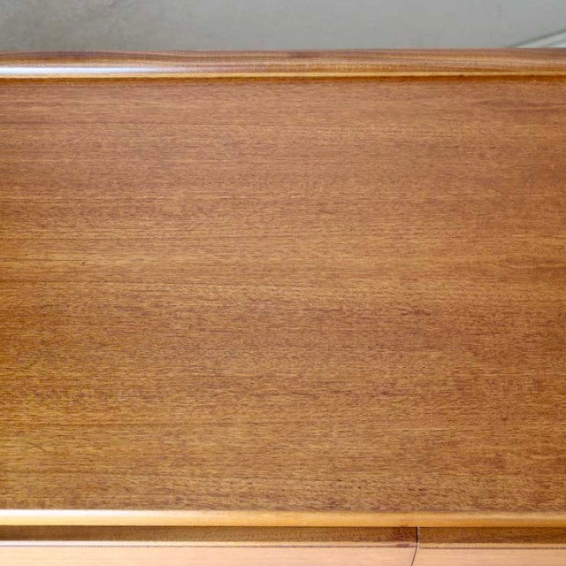 Vintage teak sideboard top showcasing smooth wood grain and clean mid-century British craftsmanship.