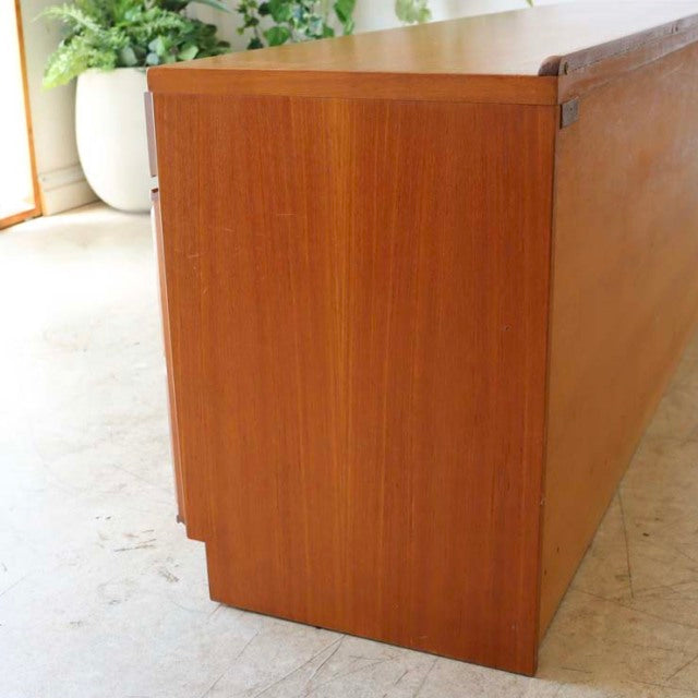 Mid-century British McIntosh sideboard in vintage teak with smooth wood grain and clean, rectangular form.