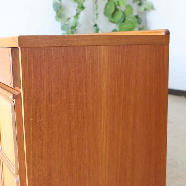 Vintage mid-century teak sideboard by British brand McIntosh, smooth wood grain, clean lines, and slender legs.