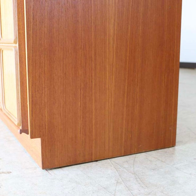 Vintage teak sideboard corner with rich wood grain, clean mid-century lines, and British-Denmark design elements.