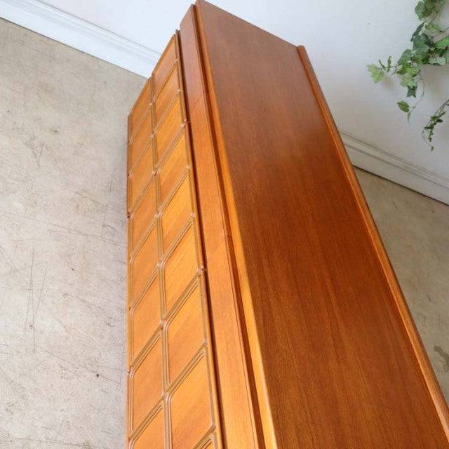 Vintage teak McIntosh sideboard with mid-century British design, smooth grain, and slender legs.