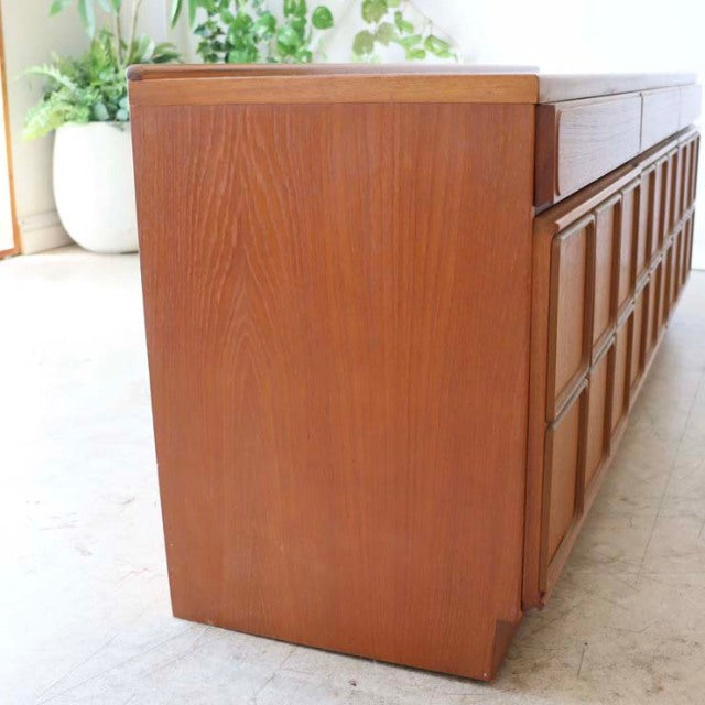 Mid-century British vintage teak sideboard by McIntosh with rich wood grain and sleek rectangular form.