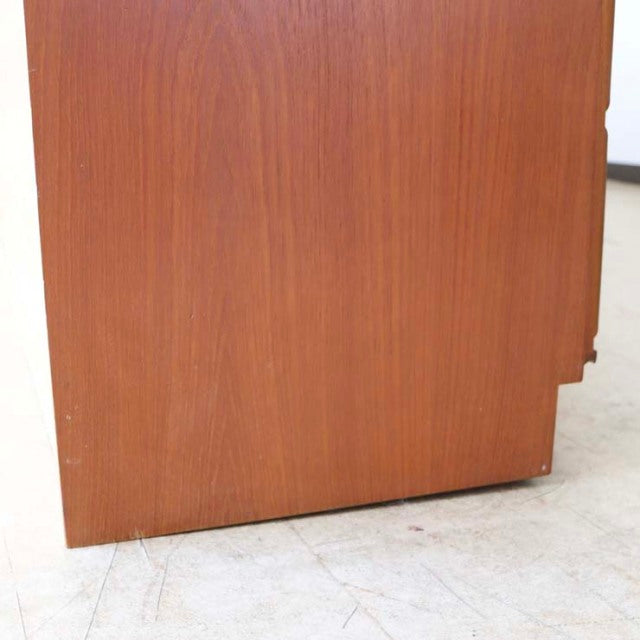 Mid-century British vintage teak sideboard by McIntosh with smooth wood grain and tapered legs.