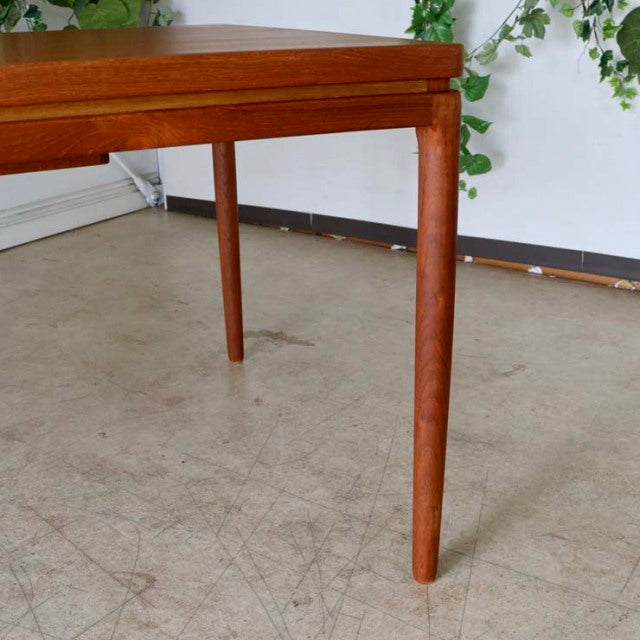 Mid-century vintage teak dining table leg from Johannes Andersen, sleek tapered design, warm wood grain finish, Danish and.