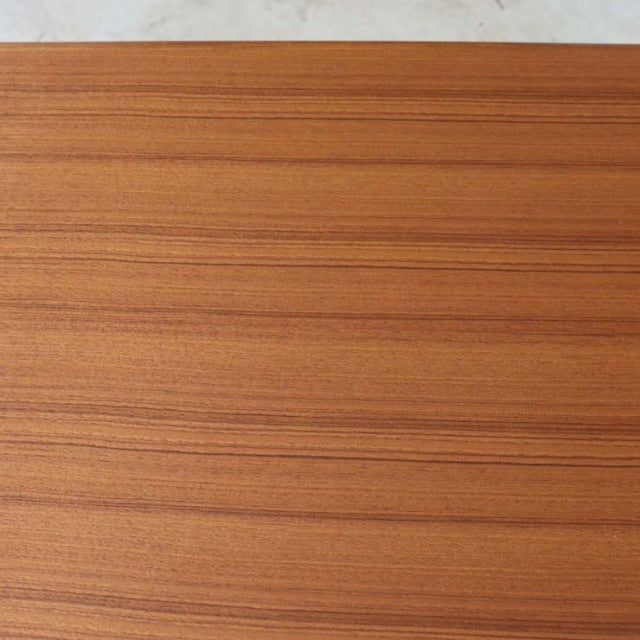 Mid-century vintage teak dining table top with warm wood grain from British Denmark design.