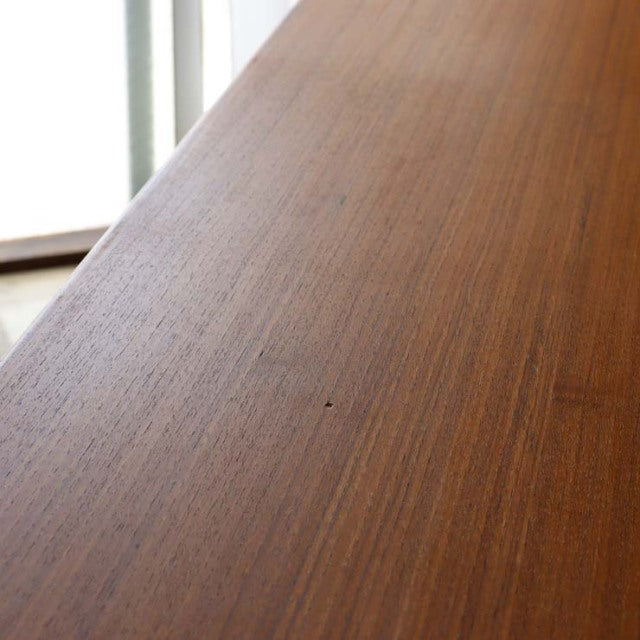 Vintage mid-century teak dining table top showcasing fine wood grain and smooth finish from British-Denmark design.