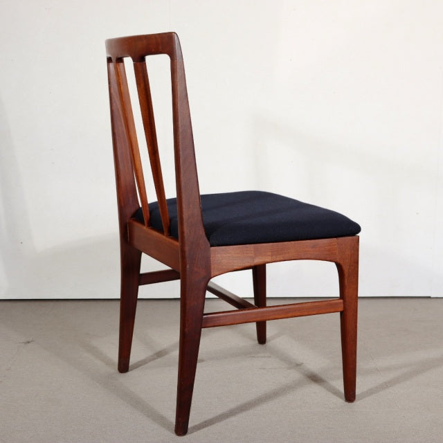 Vintage teak dining chair with sleek British mid-century design, Danish-inspired solid wood frame and black upholstered seat.