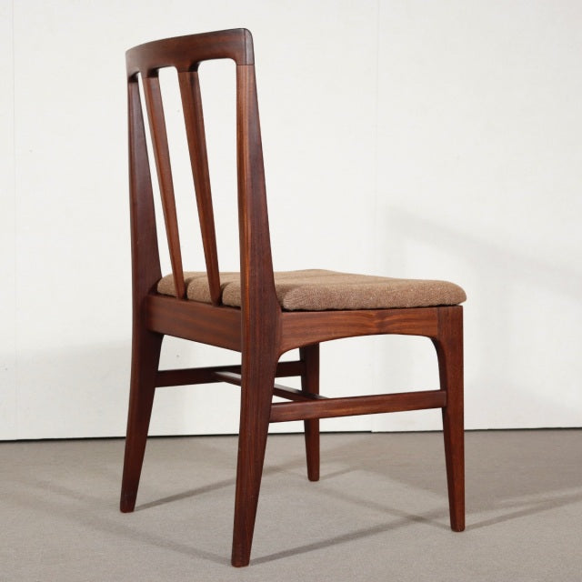 Mid-century British vintage teak dining chair by Younger with angled legs and slatted backrest, cushioned seat upholstered.