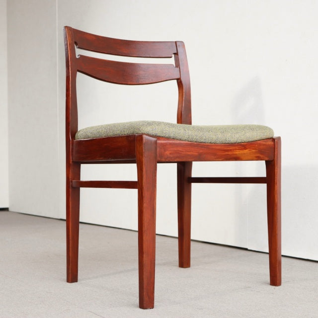Vintage teak dining chair by Nathan with British mid-century design, clean wood grain, and cushioned seat.