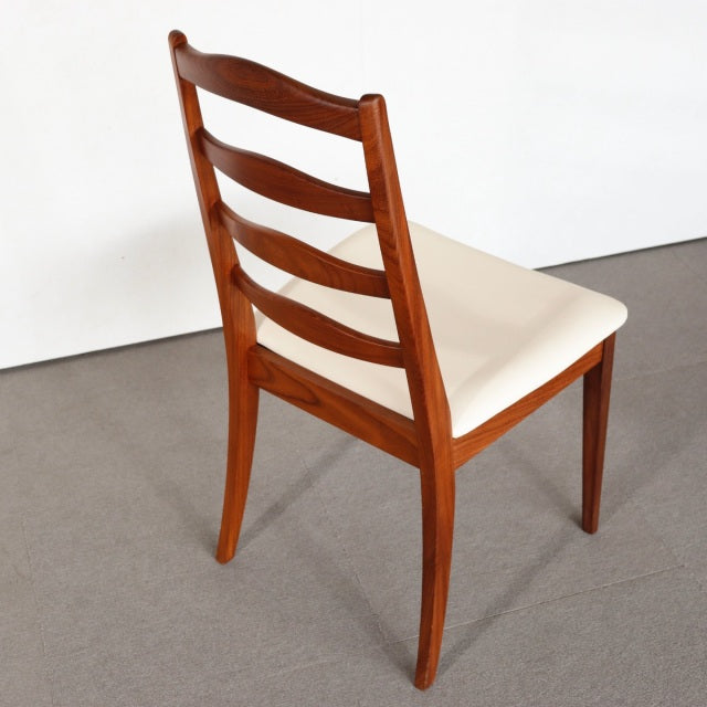 Vintage British mid-century teak dining chair by G-PLAN with ladder back and cream cushioned seat.