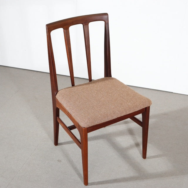 Vintage teak dining chair by Younger featuring a mid-century British design with clean lines and beige upholstered seat.