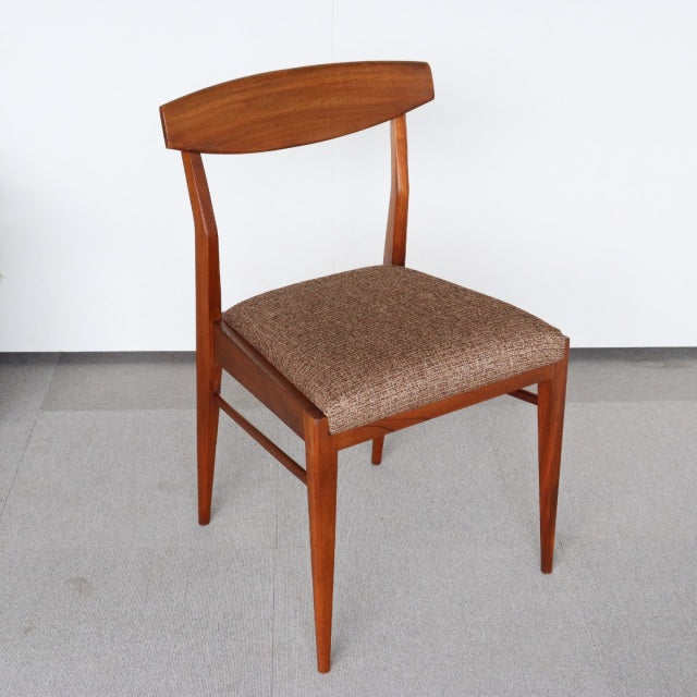 Mid-century British vintage teak dining chair by McIntosh with curved backrest and brown upholstered seat.